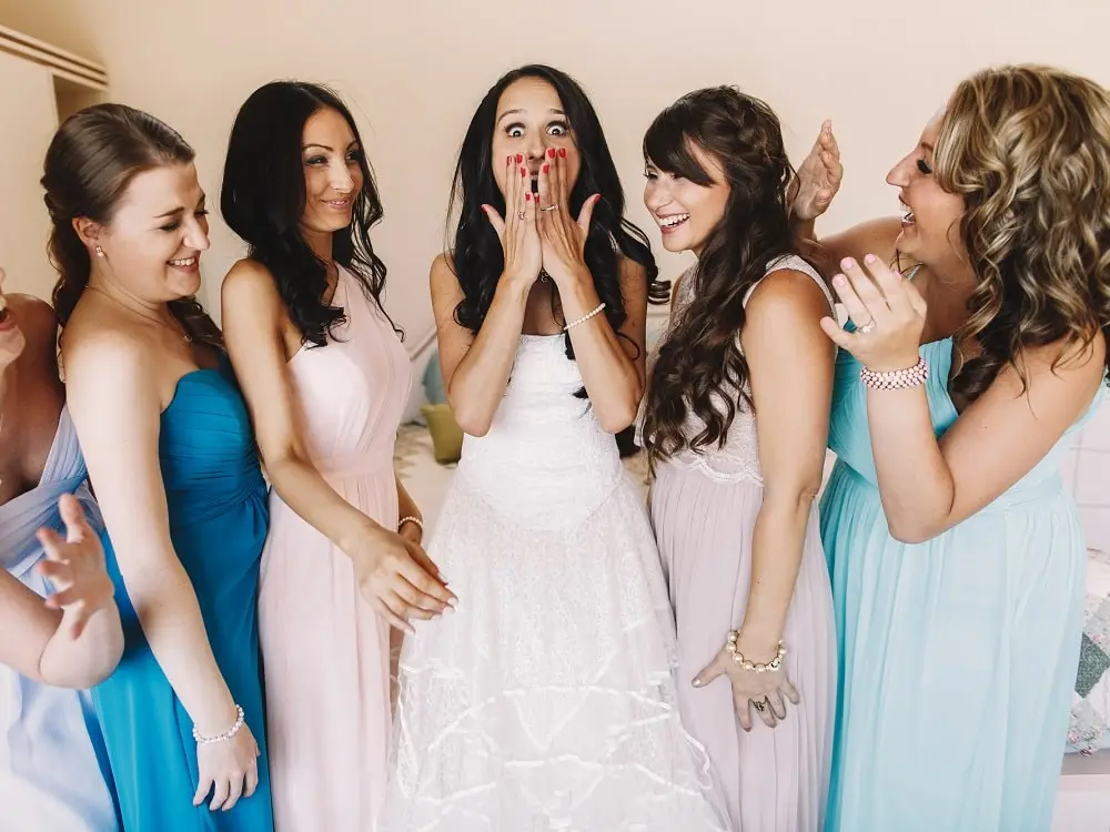 4 bridesmaids having fun at their friends wedding in Rhode Island