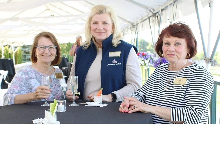 3 business women at corporate event