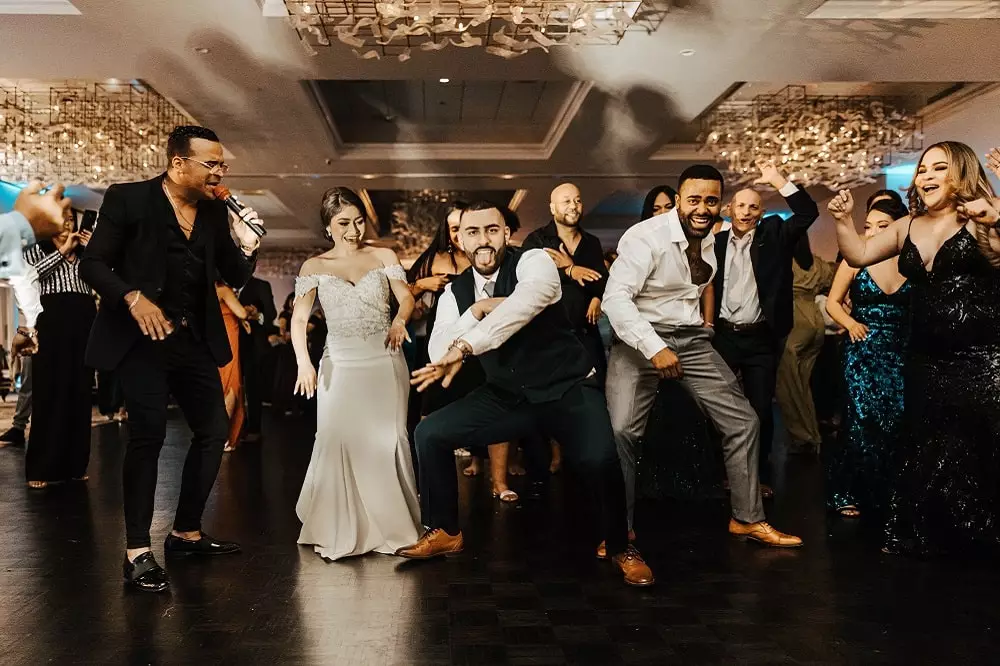 Guests having fun on dancefloor at a wedding reception