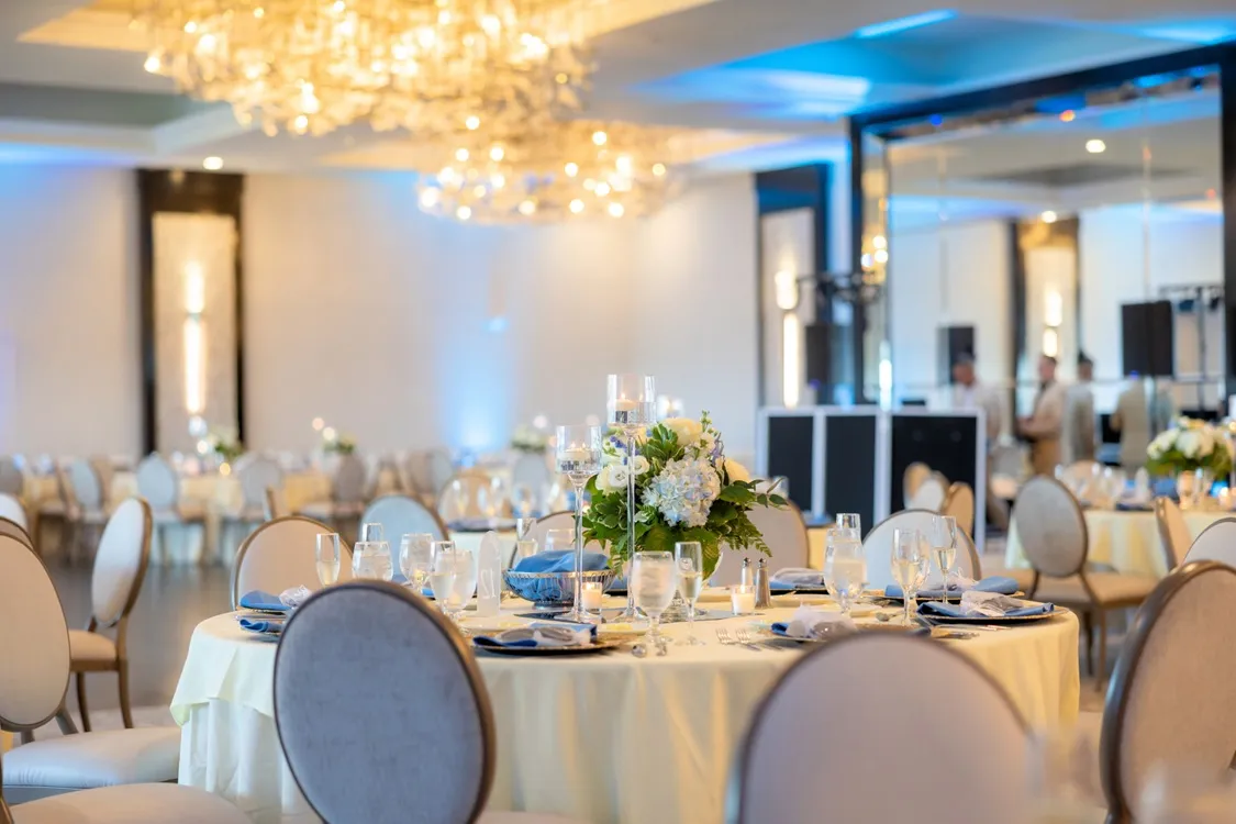 a wedding rehearsal dinner at Kirkbrae Country Club with ornately decorated tables and crystal centerpieces